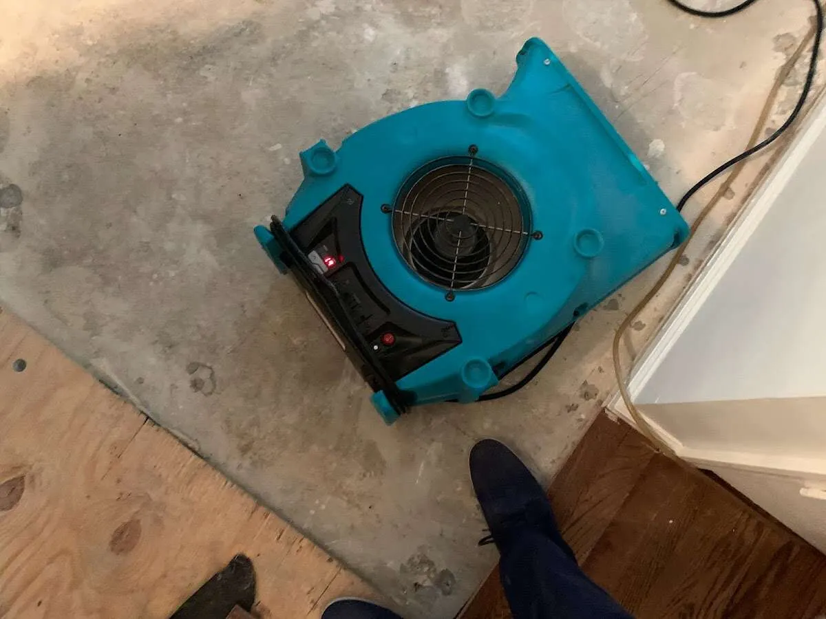 Air mover drying subfloor during Commercial Water Damage Restoration in Glenarden